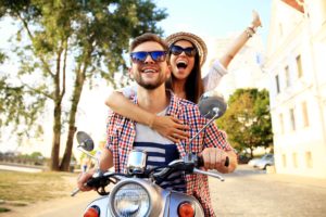 Young Happy Couple on a Motorcycle