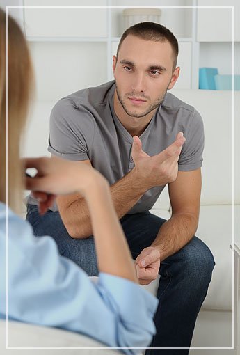 Man Speaking with his Therapist at Armstrong Family Counseling