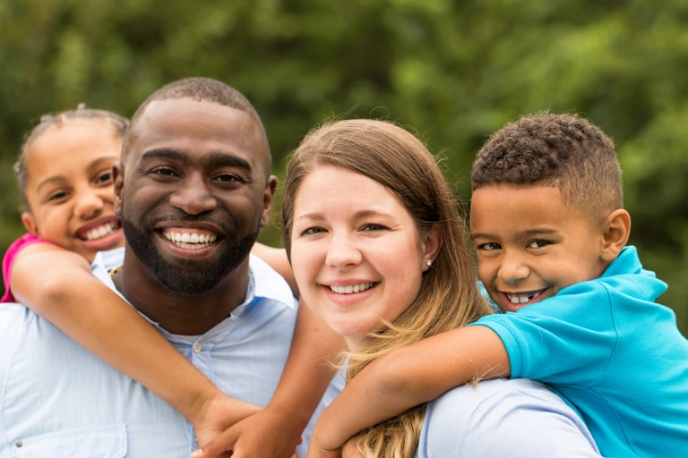 A mixed race family benefits from family counseling at Armstrong Family Counseling