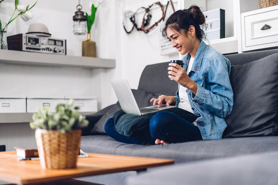 A woman joins an online sleep coaching session from her living room