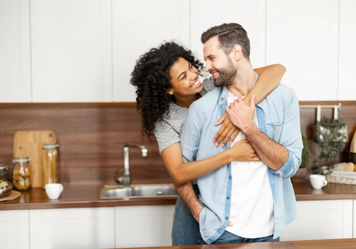 A happy couple shares affection for each other thanks to marriage counseling